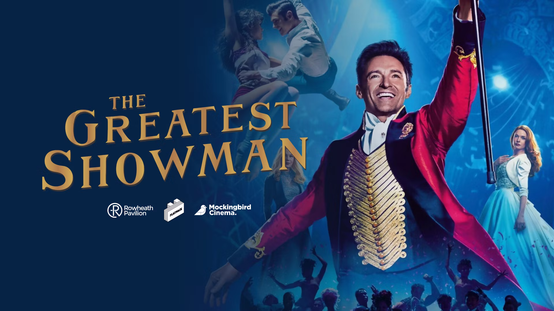 Showman in red coat swings cane as people dance, with “The Greatest Showman” title over blue backdrop.